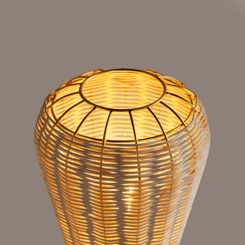 Top view of the rounded rattan shade with gold circular metal framing