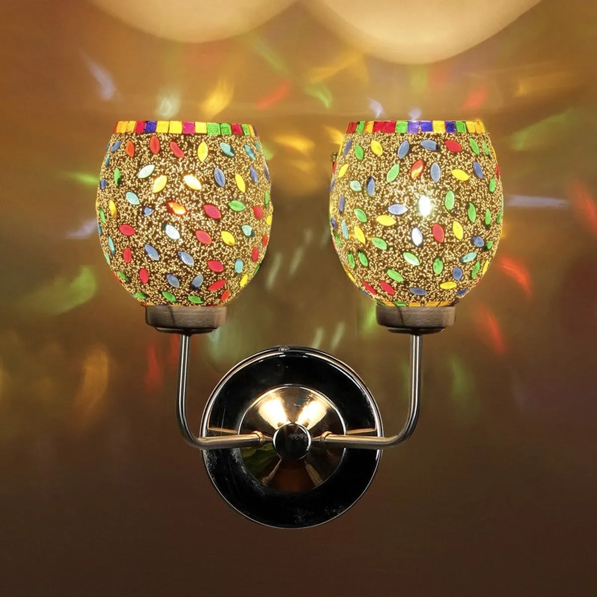 Close view of illuminated dual-shade mosaic glass wall lamp