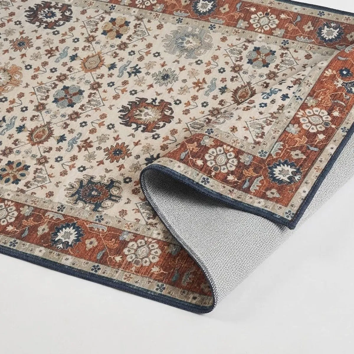 Close-up of the carpet's floral motif, bordered pattern and underside