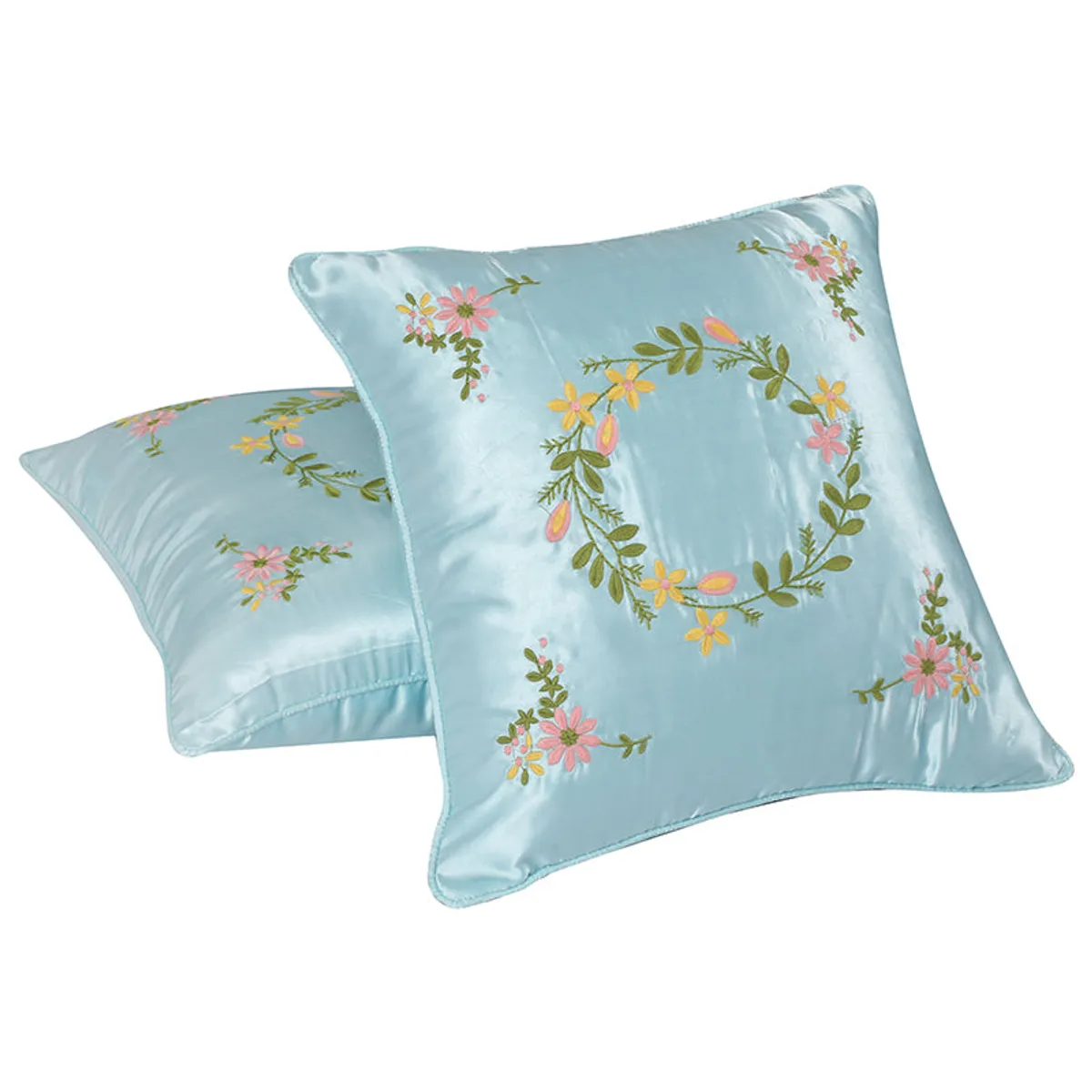 Two blue square cushion covers with floral embroidery on a white background