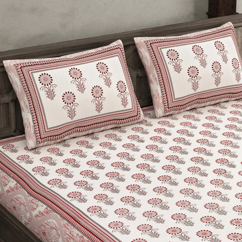 Close view of pink and white floral bedsheet with matching pillow covers
