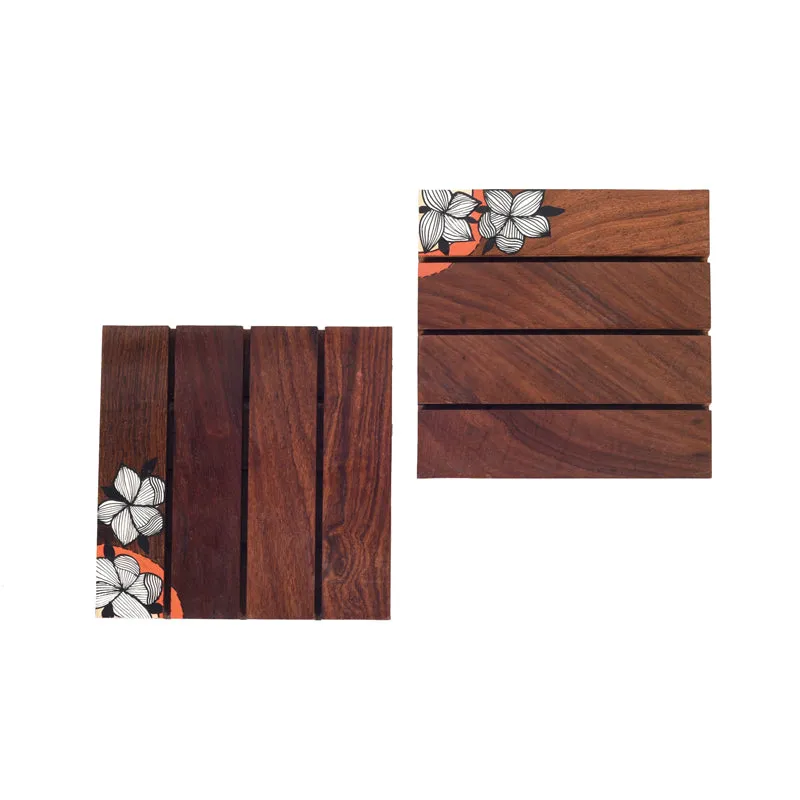 Two brown wooden coasters shown flat, each with a floral corner detail
