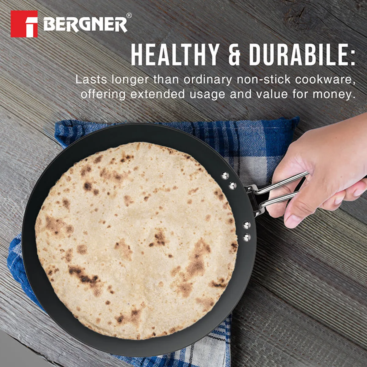 Round black Roti Tawa holding a cooked roti, viewed from above