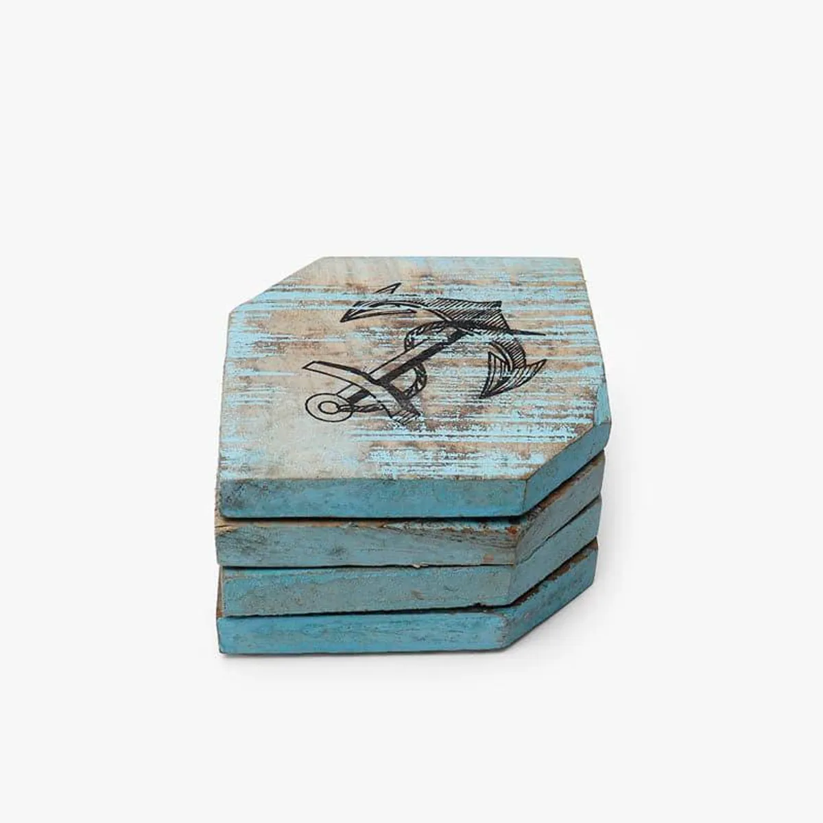 Stack of blue wooden coasters with anchor artwork on a white background