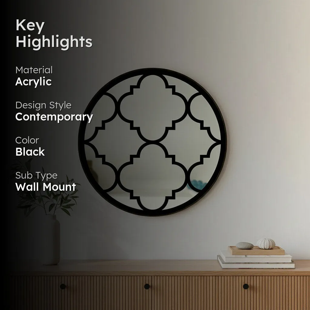 Round black wall mirror displayed above a wooden console