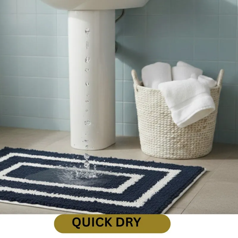 Blue and white bath mat shown absorbing water beneath a tap
