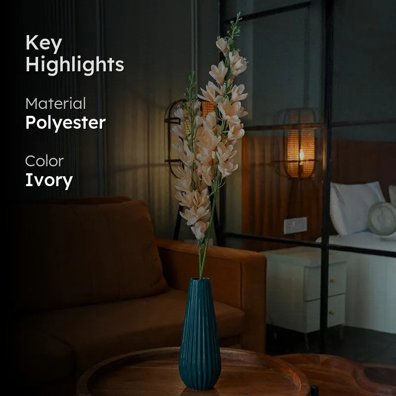 Ivory artificial flower stick in a living room setting with material and colour highlights.
