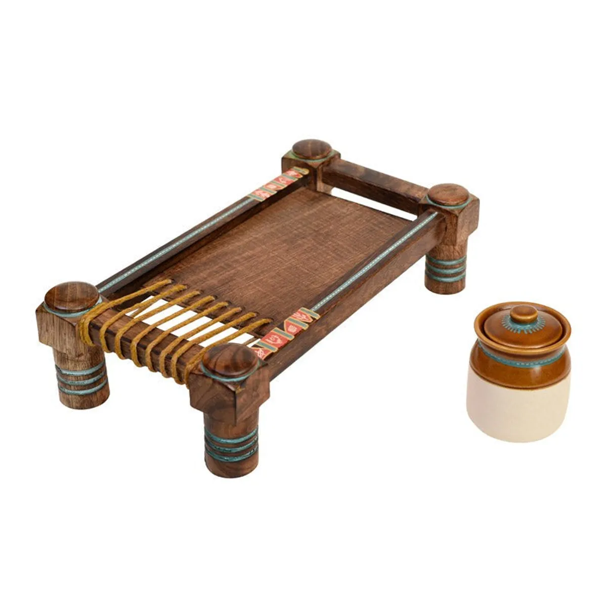 Wooden charpoy-style tray with a ceramic jar placed beside it