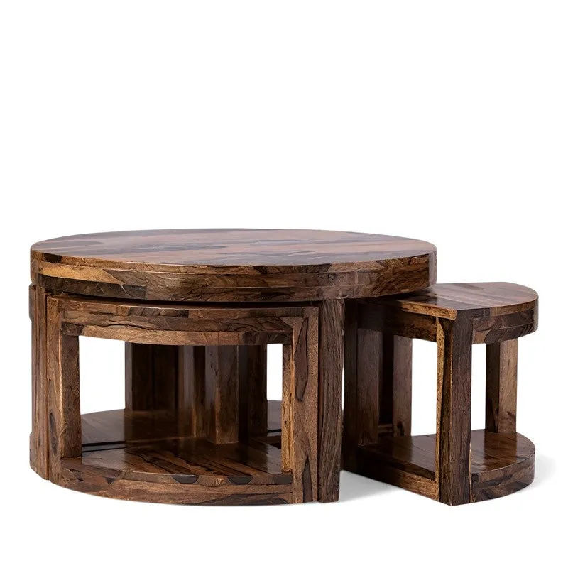 Brown wooden round center table with nested stools on a white background