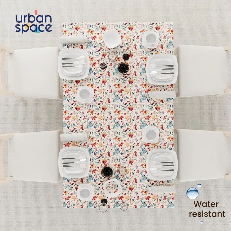 Top view of a multicolour floral table cover on a dining table