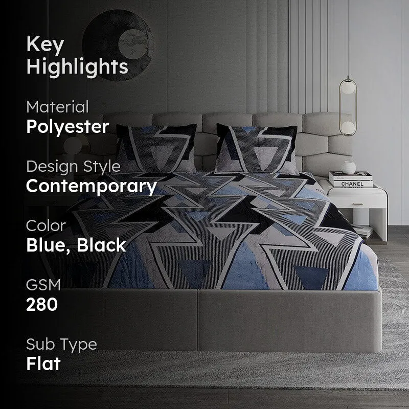 Blue and black geometric bedsheet on a bed in a contemporary bedroom