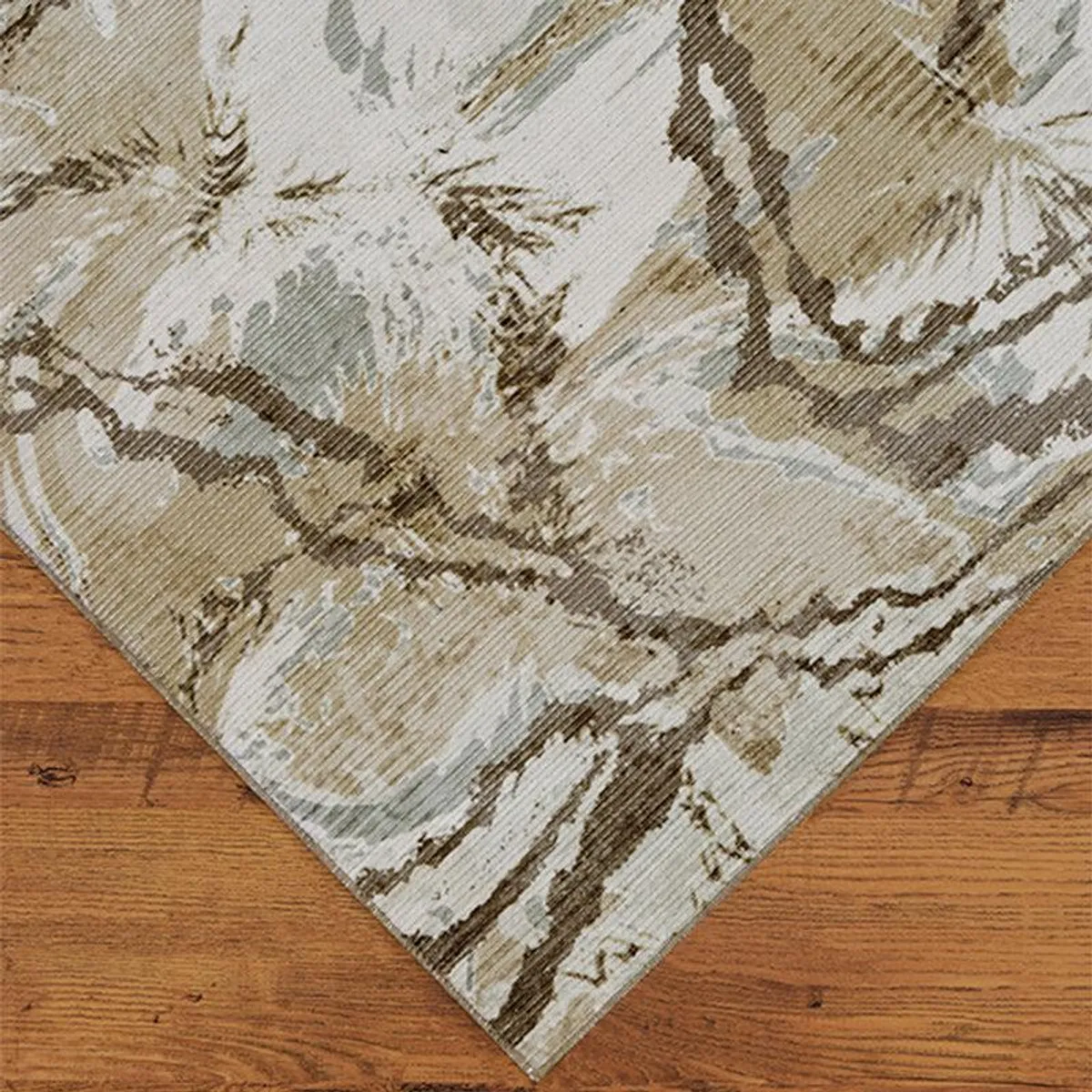 Close-up of beige and green abstract carpet with sweeping marbled lines