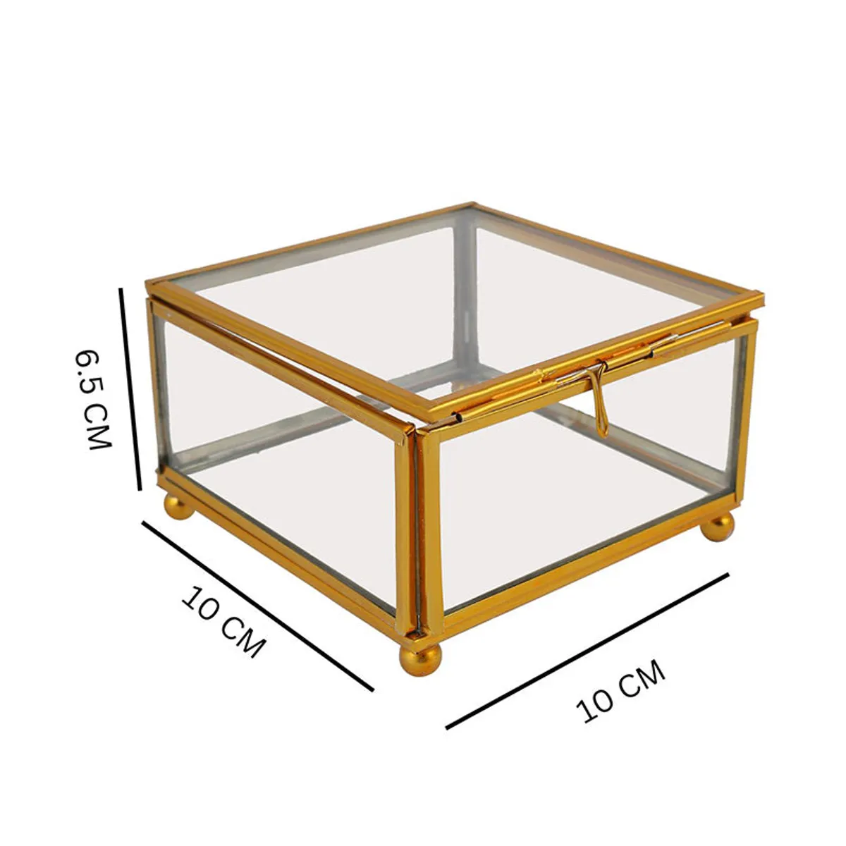 Closed transparent glass jewel box with gold frame shown with dimensions