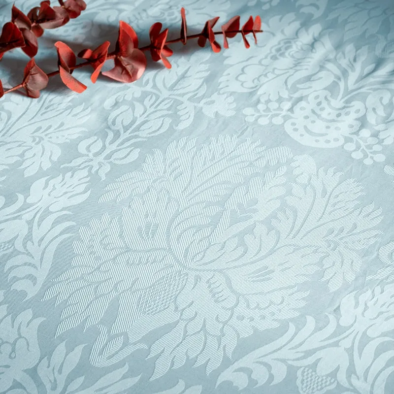 Close-up of pale blue floral jacquard pattern on fabric
