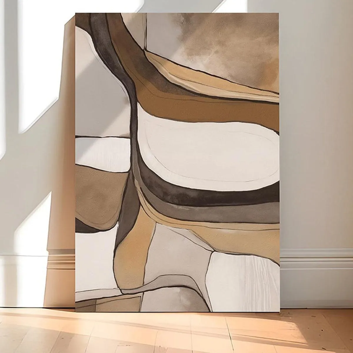 Framed view of abstract beige and brown canvas art in soft natural light
