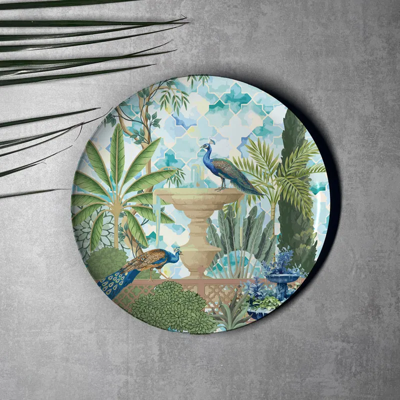 Round wall plate with peacocks, fountain and leafy garden motif