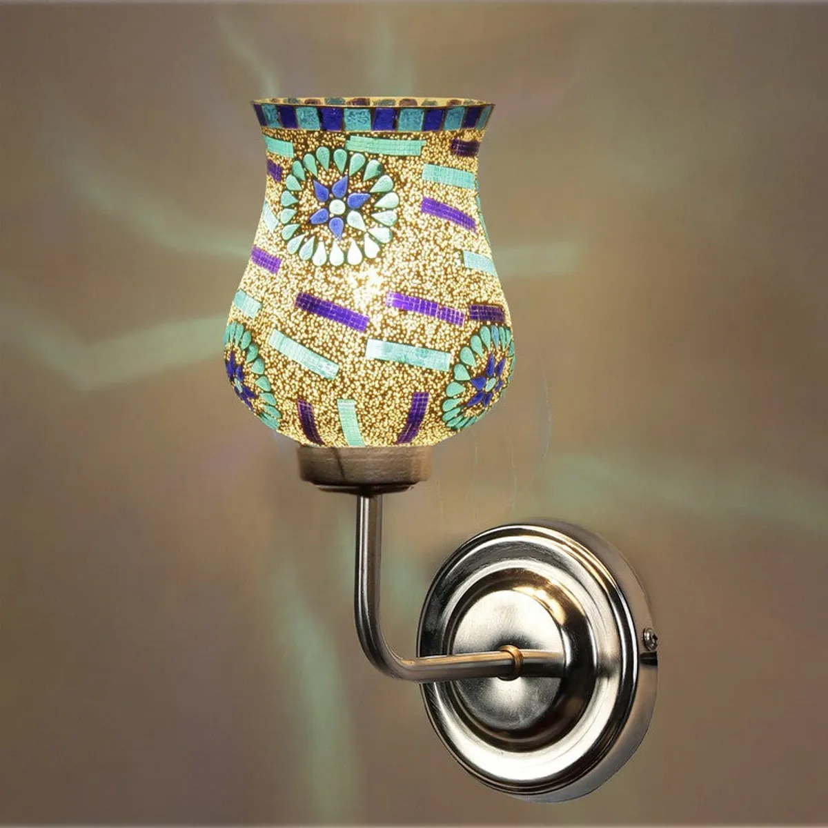 Close-up of lit multicolour mosaic glass wall lamp