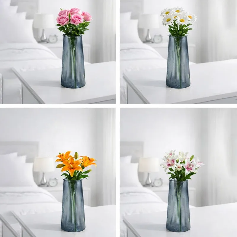 Four styled views of the grey vase with different flowers