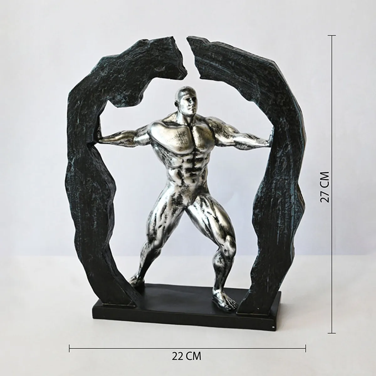 Silver and black figurine showpiece photographed against a white background