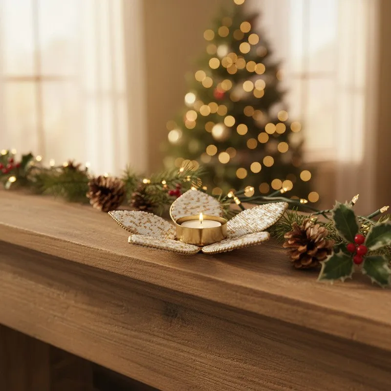 Beaded petal candle holder styled on a festive mantel with warm lights