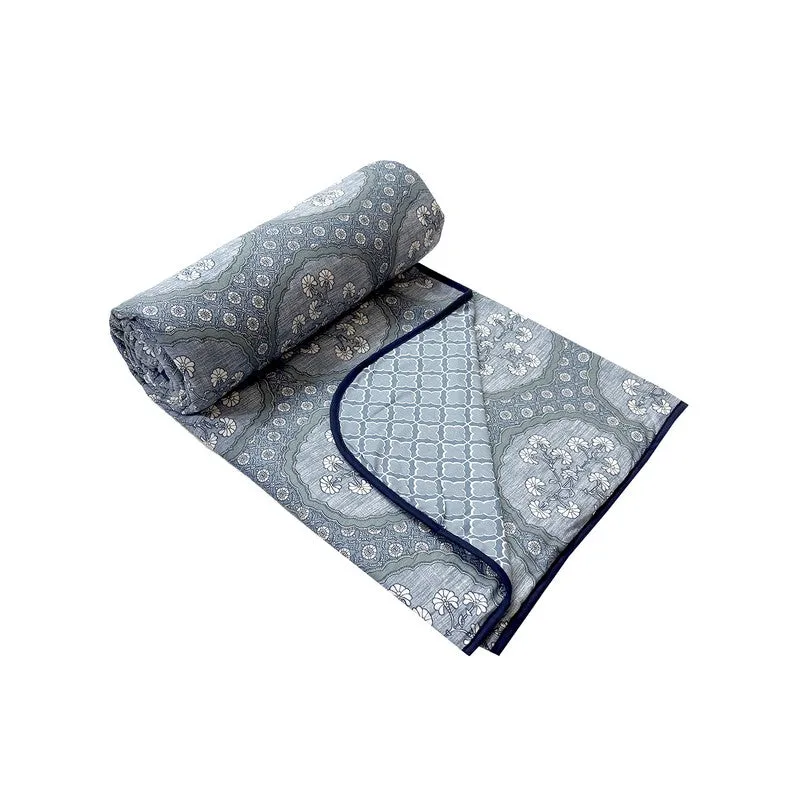 Rolled blue cotton dohar with reversible floral and geometric prints