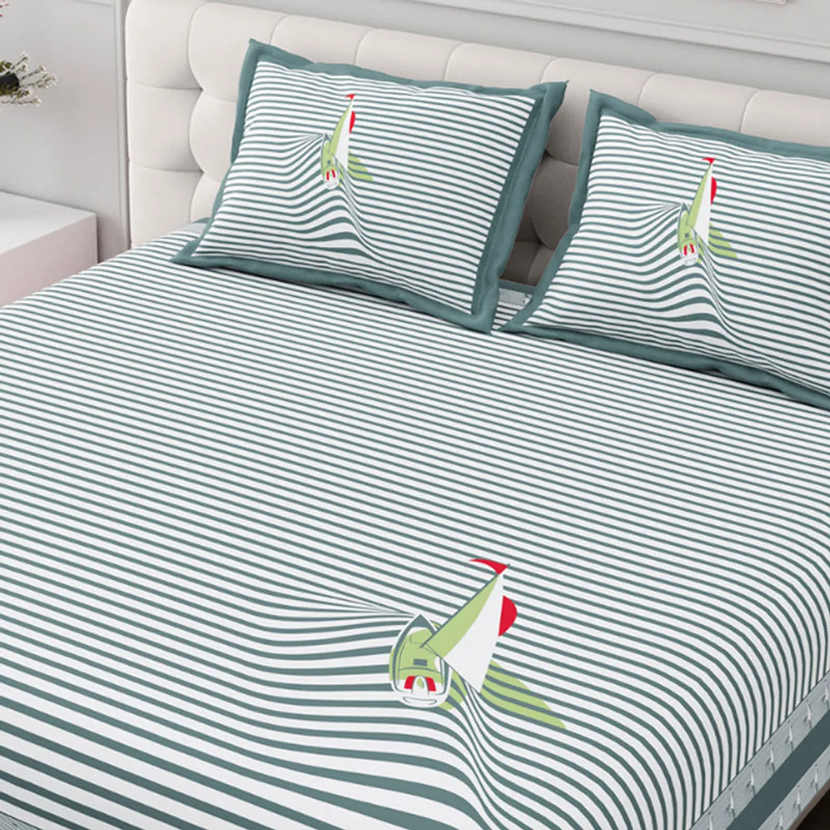 Grey and white striped bedsheet showing a central sailboat motif on the bed.