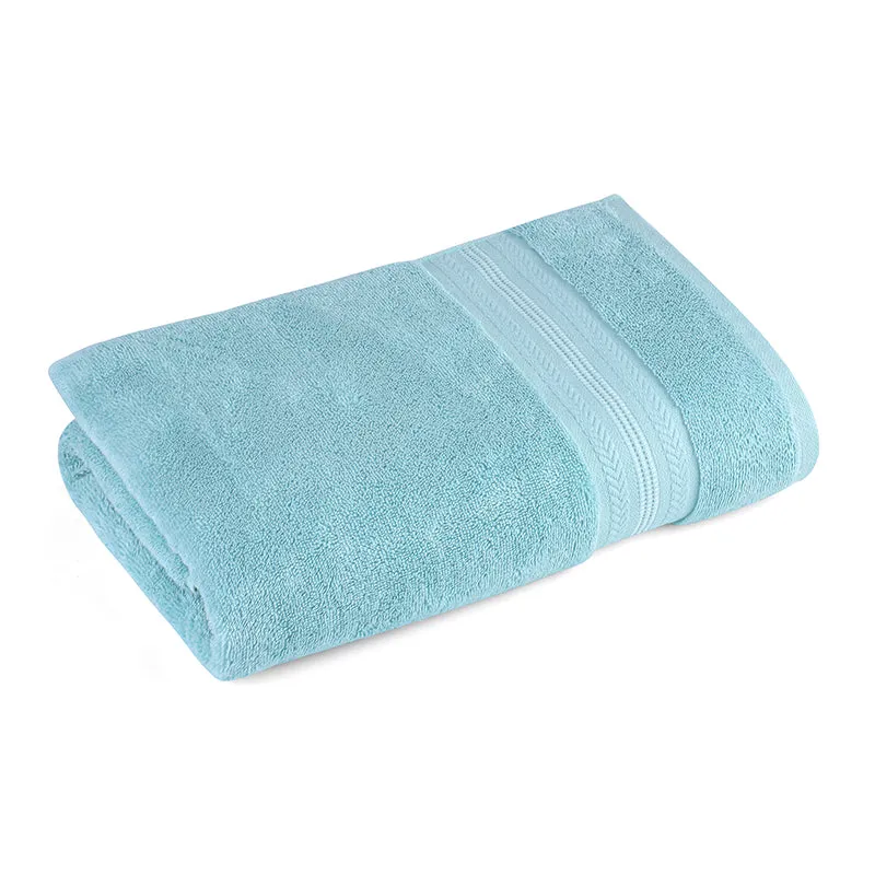 Folded blue bath towel with subtle textured border detailing