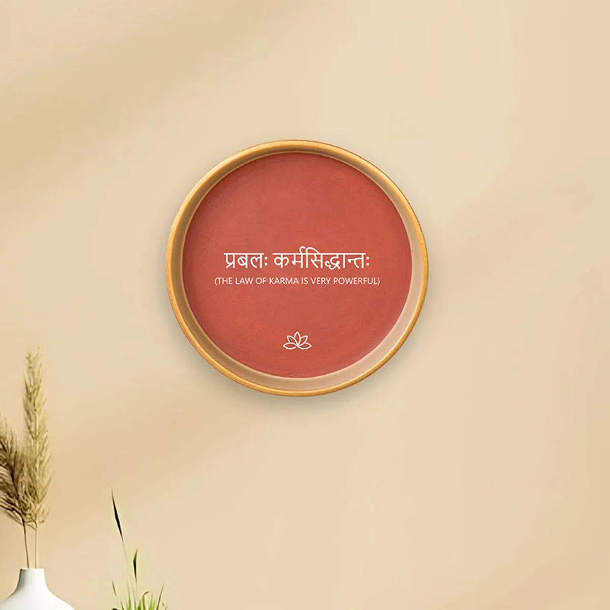 Terracotta wall plate displayed on a beige wall
