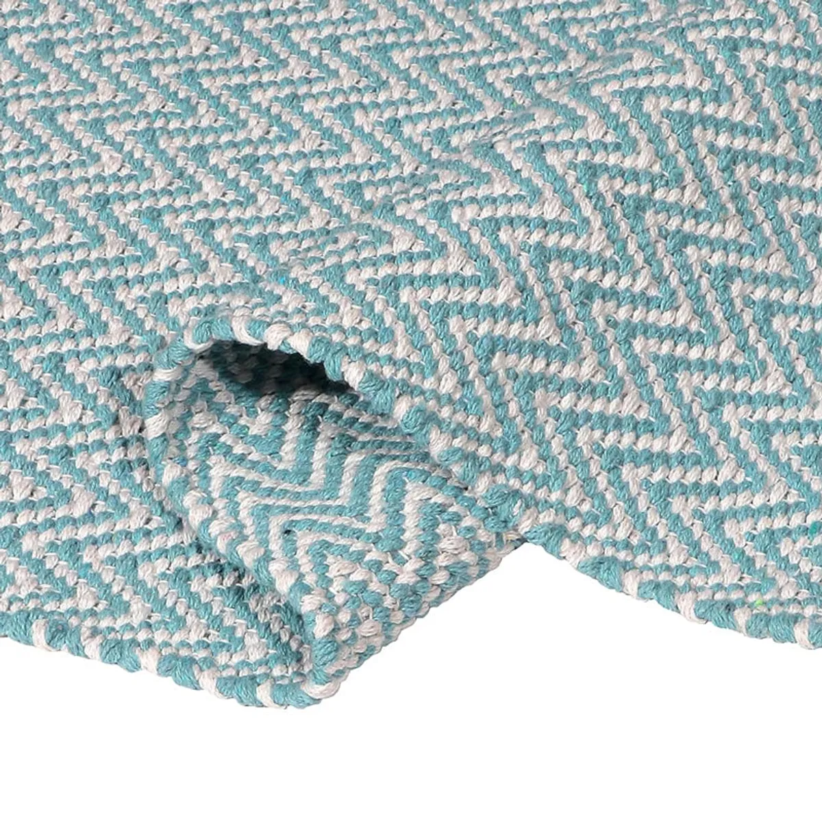 Folded section of the sky blue and white patterned runner rug