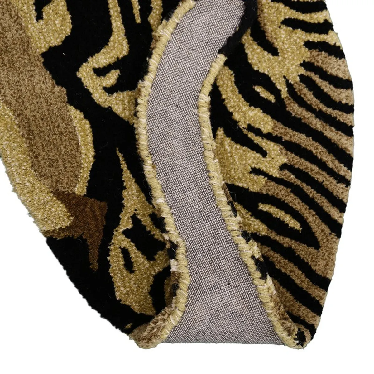 Underside detail showing the edge and grey surface of the tiger carpet