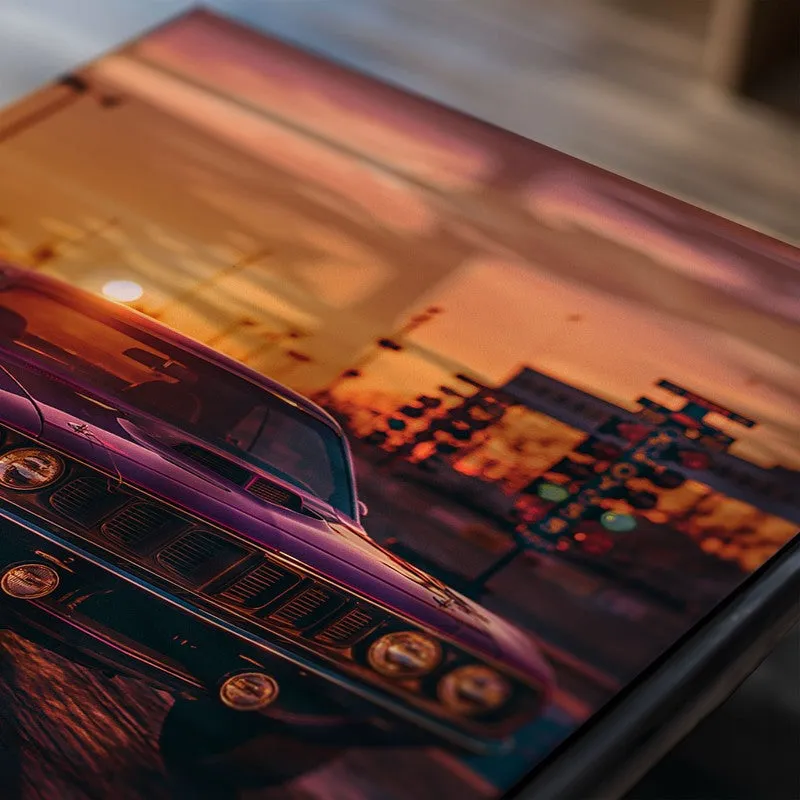 Close-up of a muscle car poster with sunset tones and glossy surface