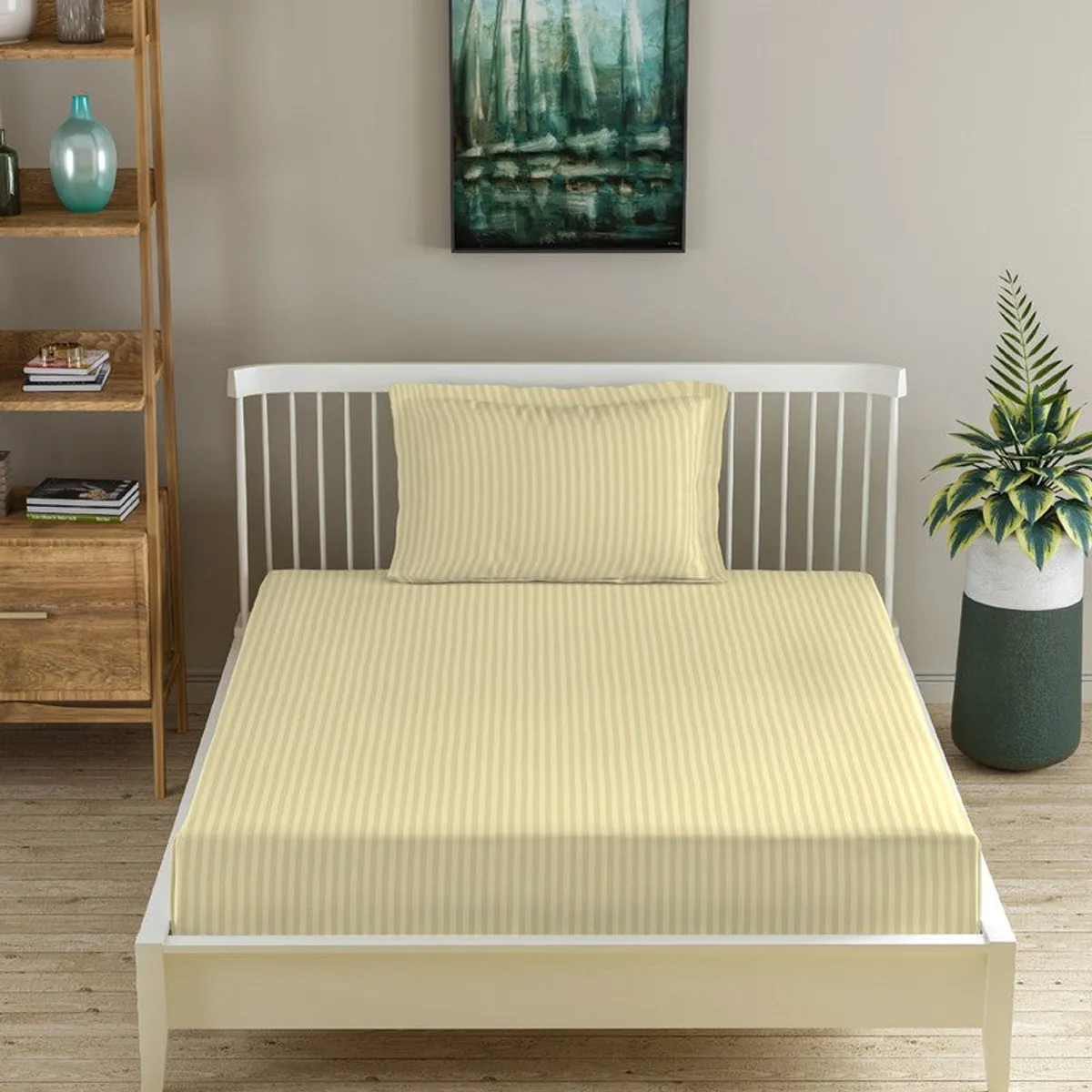 Beige striped fitted bedsheet and matching pillow cover on a white bed frame.
