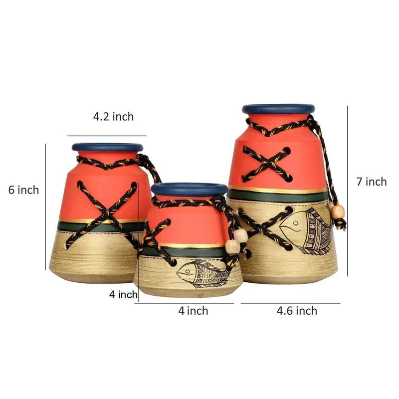 Three red and beige urn vases shown together with size markers on a white background