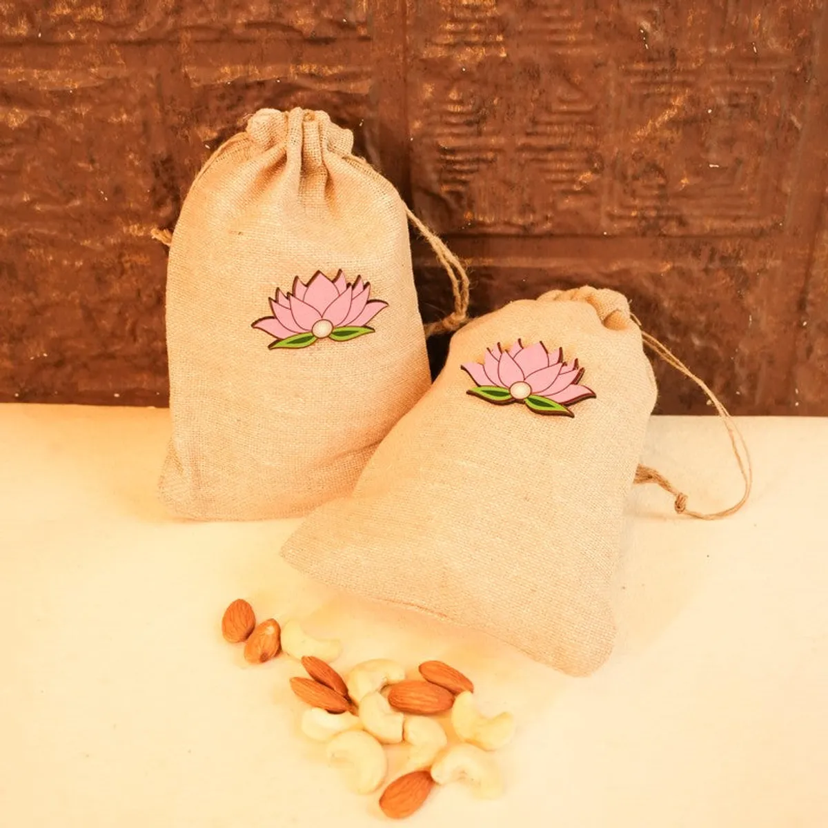 Two lotus potlis shown with cashews and almonds