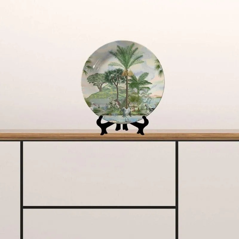 Round forest landscape plate displayed upright on a tabletop stand