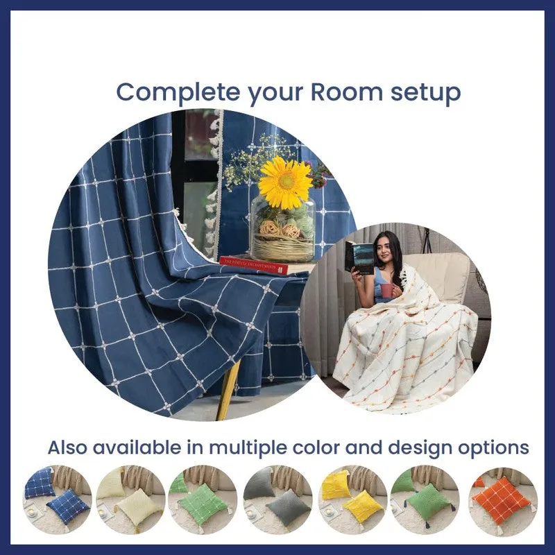 Blue checked home textile draped over a chair with colour options shown below