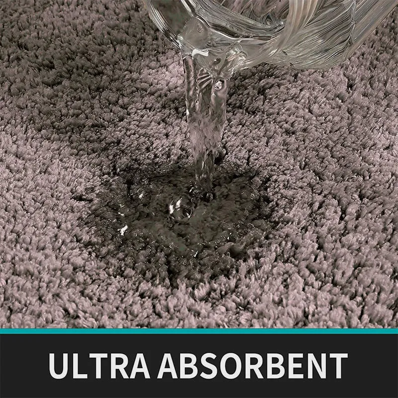 Water being poured onto the grey rug surface