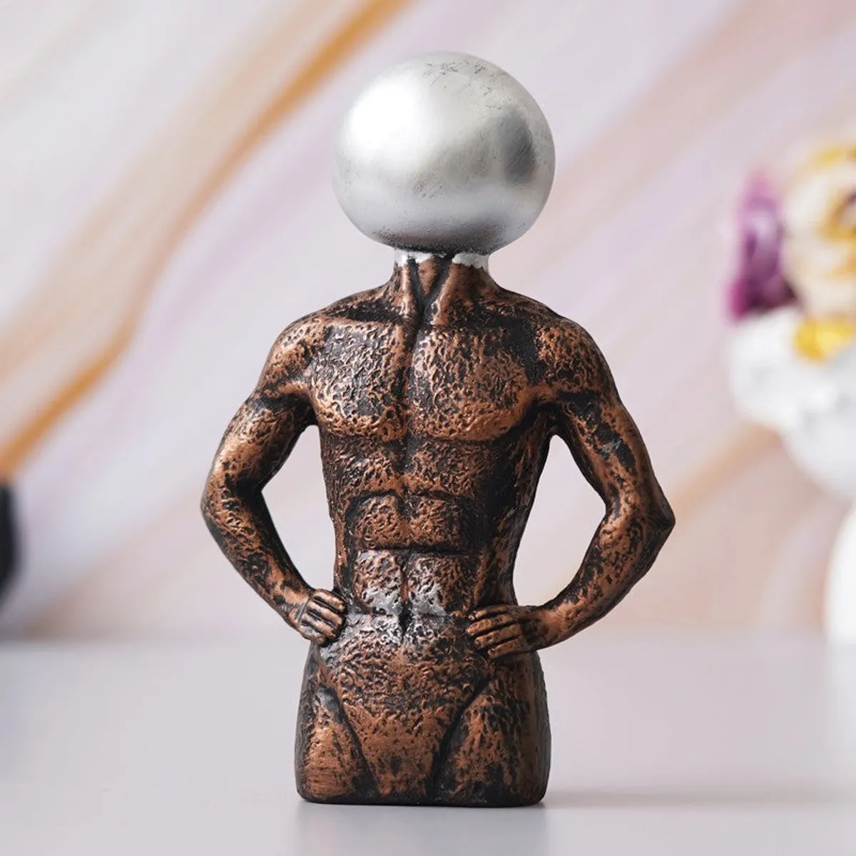 Front angle of abstract man showpiece in bronze and silver tones