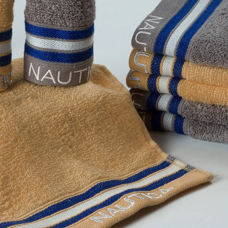 Close-up of beige towel with blue and white striped border