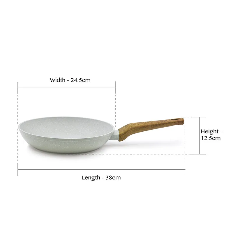 Side view of white frying pan showing its overall shape and proportions