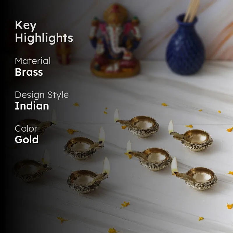 Gold brass diyas with key highlights shown in a styled setting