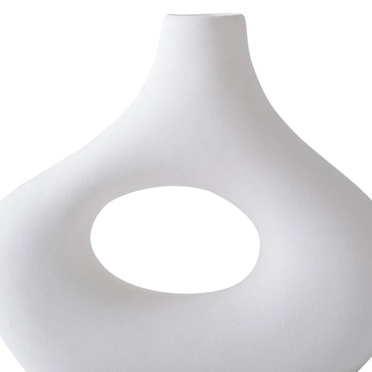 Close-up of a white sculptural vase with an oval hollow centre.