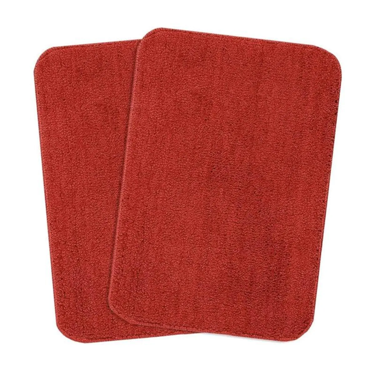 Close-up of the red textured bath mat surface and edge