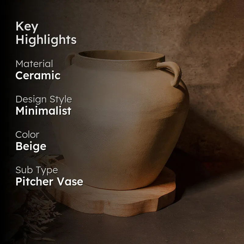 Beige ceramic vase styled against a dark warm-toned background