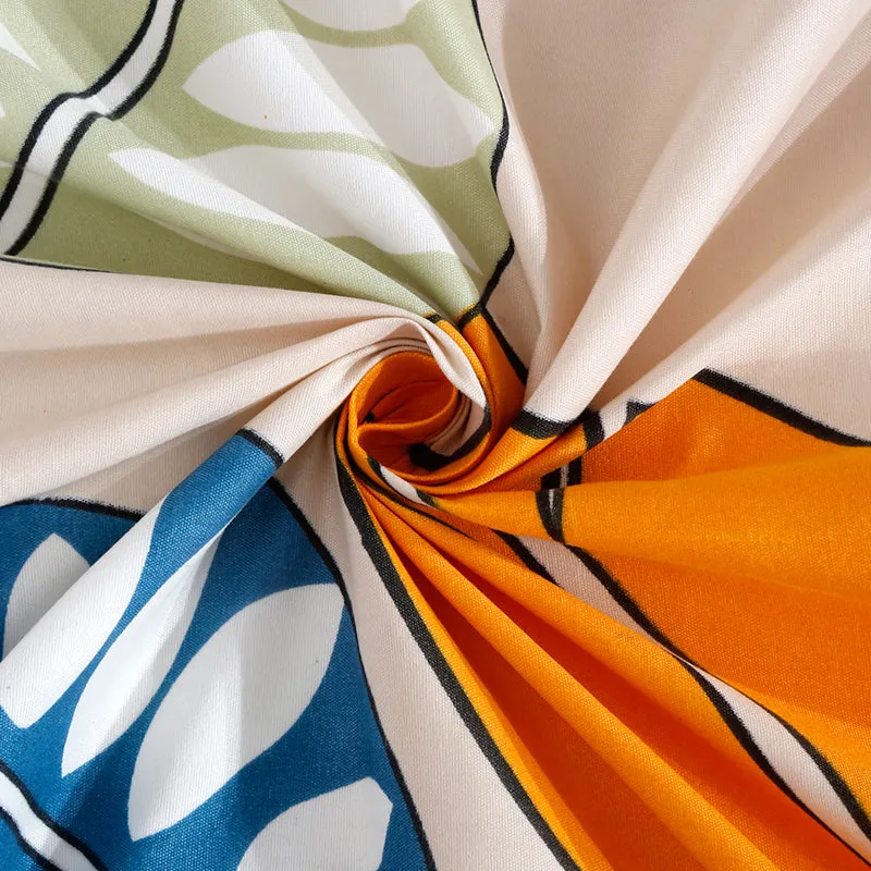 Close-up of printed fabric showing multicolour leaf pattern