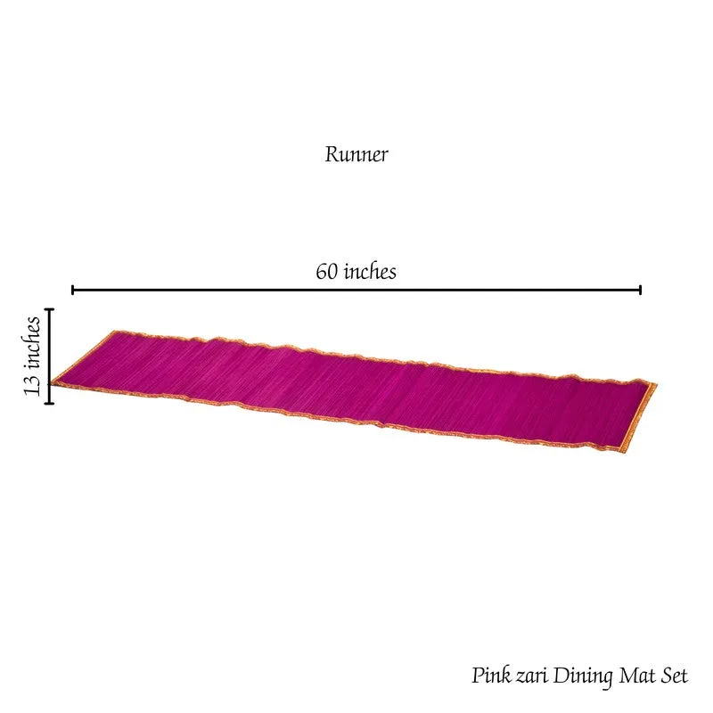 Pink and gold-edged table runner shown lengthwise on a dining table