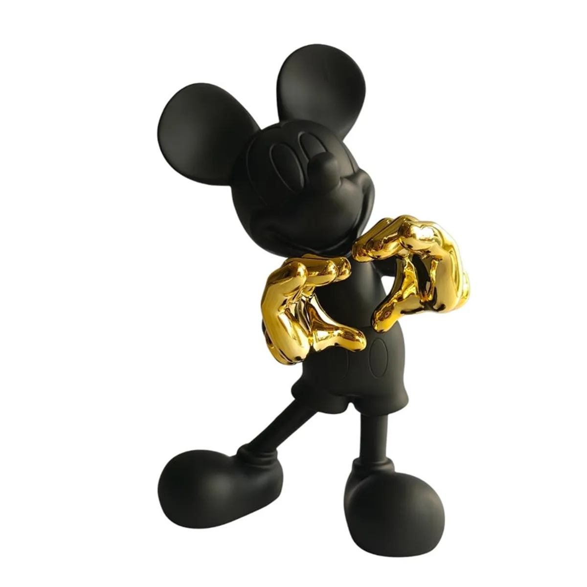 Front view of the black figurine with gold gloves against a white background.