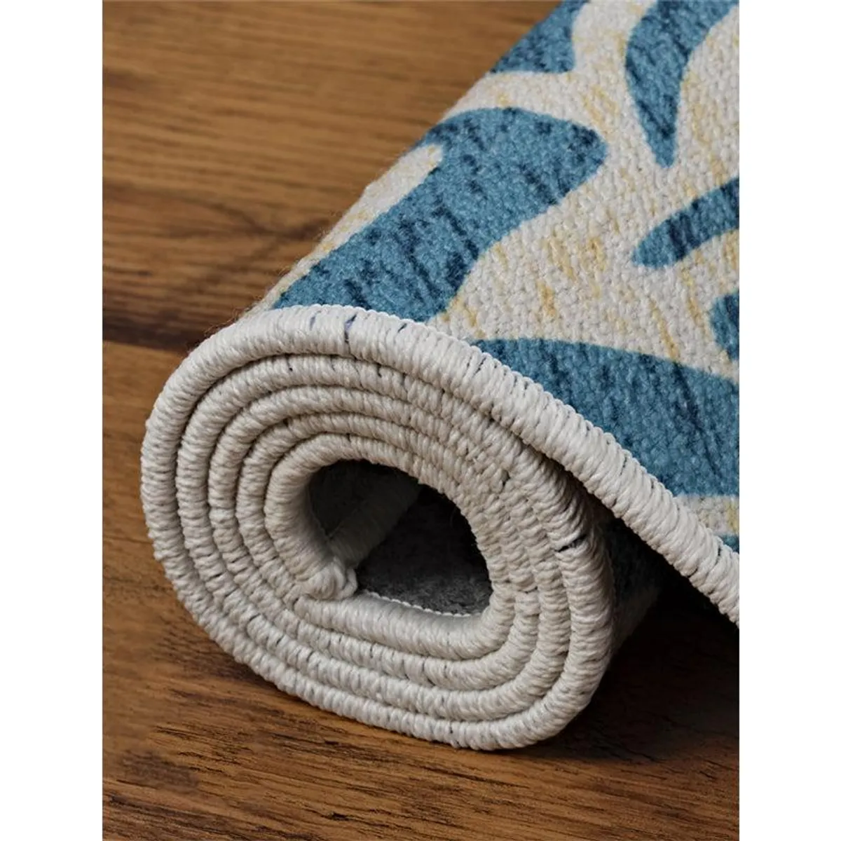 Rolled carpet showing its textured surface and underside