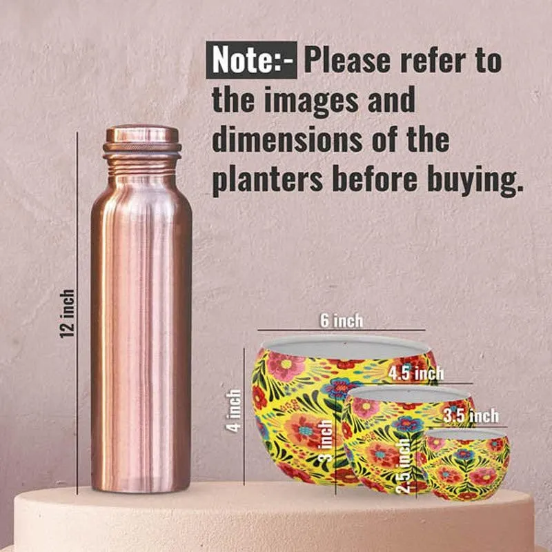 Three yellow floral planters shown beside a bottle for scale