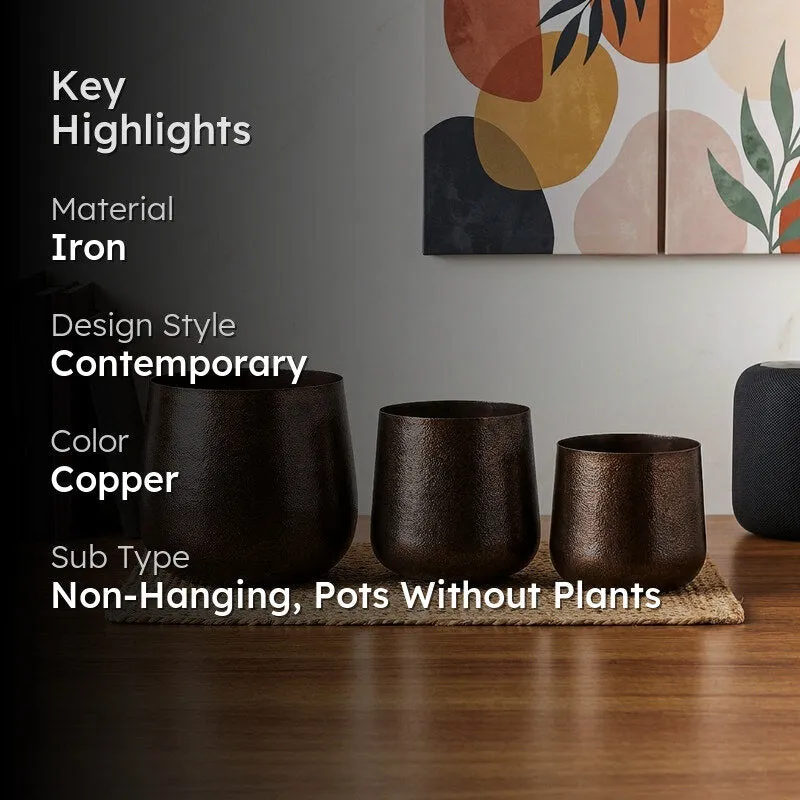 Three planters displayed in a room with a contemporary abstract artwork.